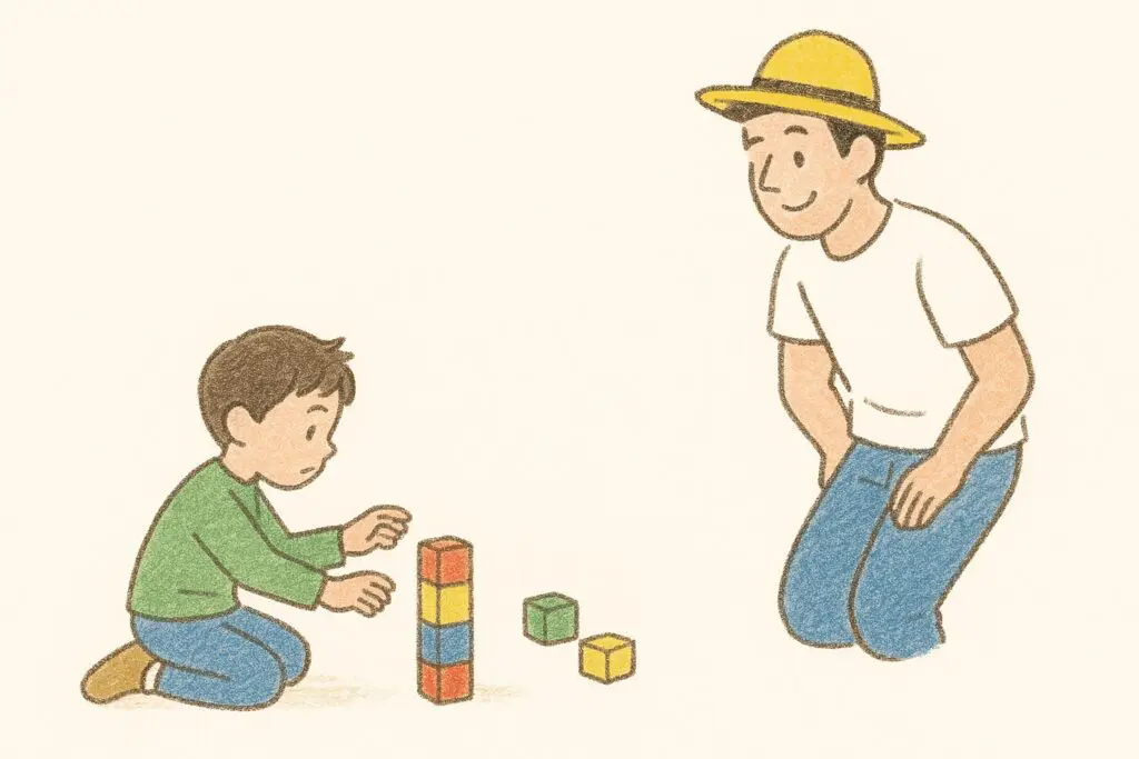 少し離れた距離から子どもを温かく見守る黄色い帽子の親