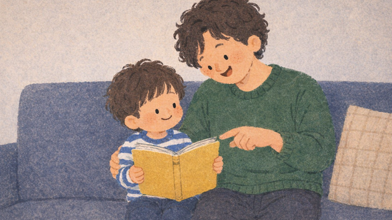 父親と子どもがソファで名前入り絵本の表紙を見せ合いながら笑い合う様子